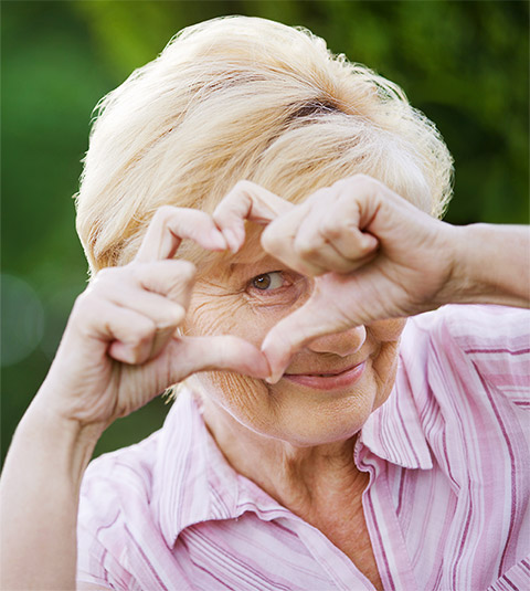 Woman making heart sign with hands