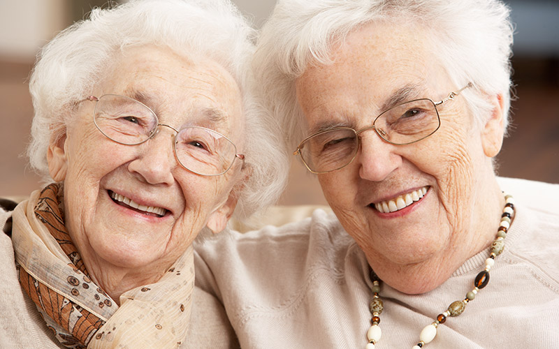 Two women posing for picture
